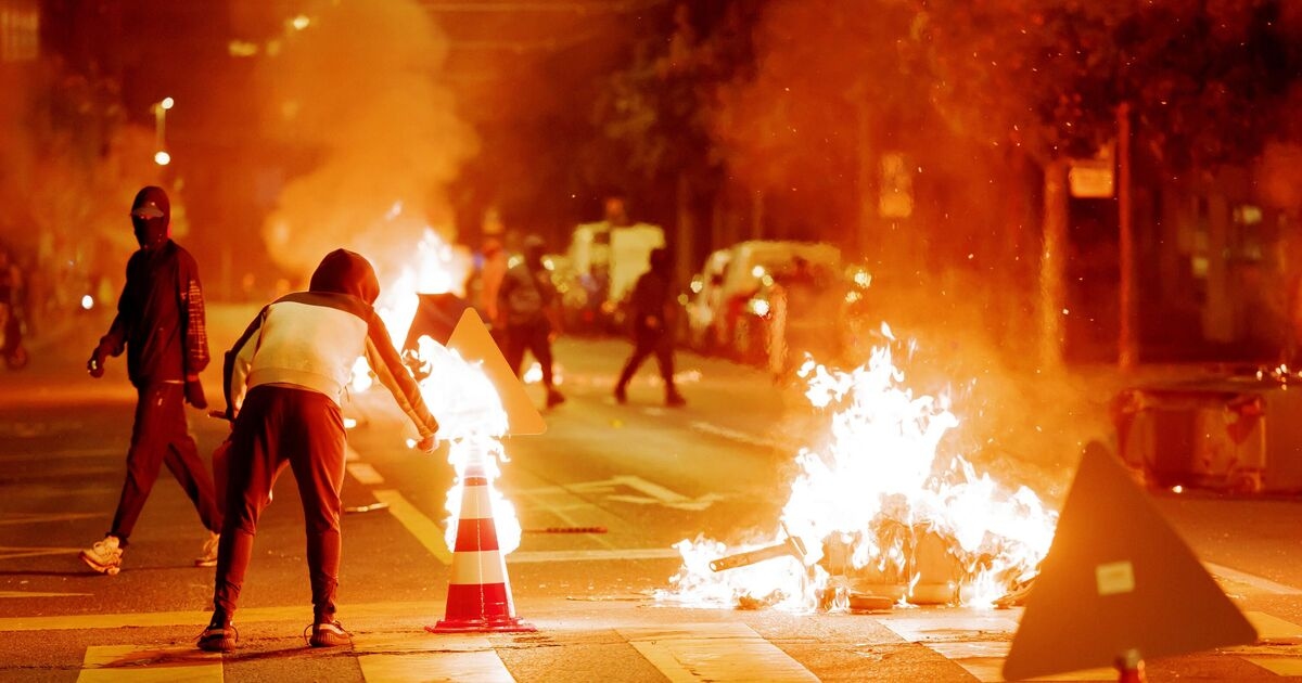 Police hit by second night of riots after migrant killed