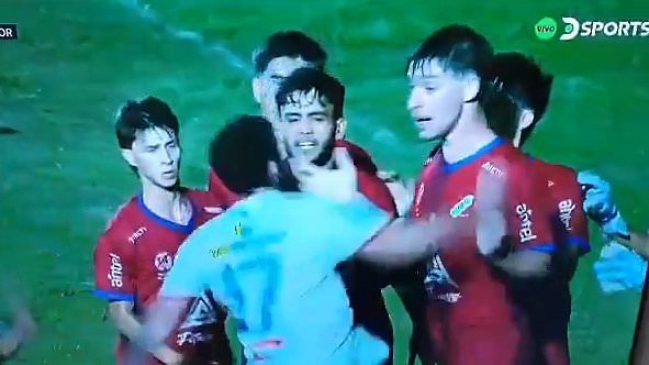 Shameful footage shows moment footballer KNOCKS OUT opponent with brutal punch - as amateur match in Uruguay descends into chaos