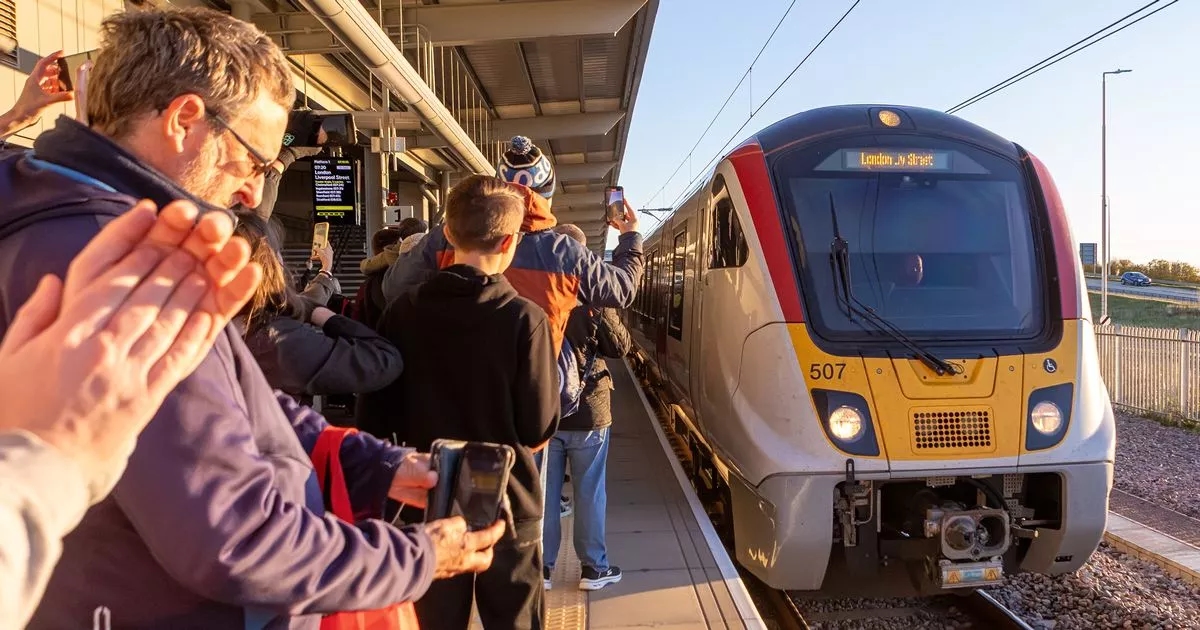 Crowds clap and cheer train arriving at first new station for 100 years