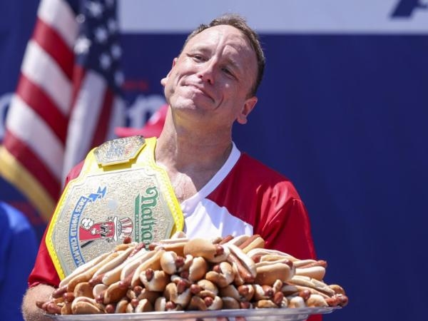 Unbeatable? The 'hot dog king' devours 70 hot dogs in 10 minutes.