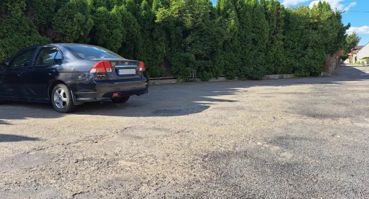 The parking lot is finally patched up. The rest are still waiting their turn.